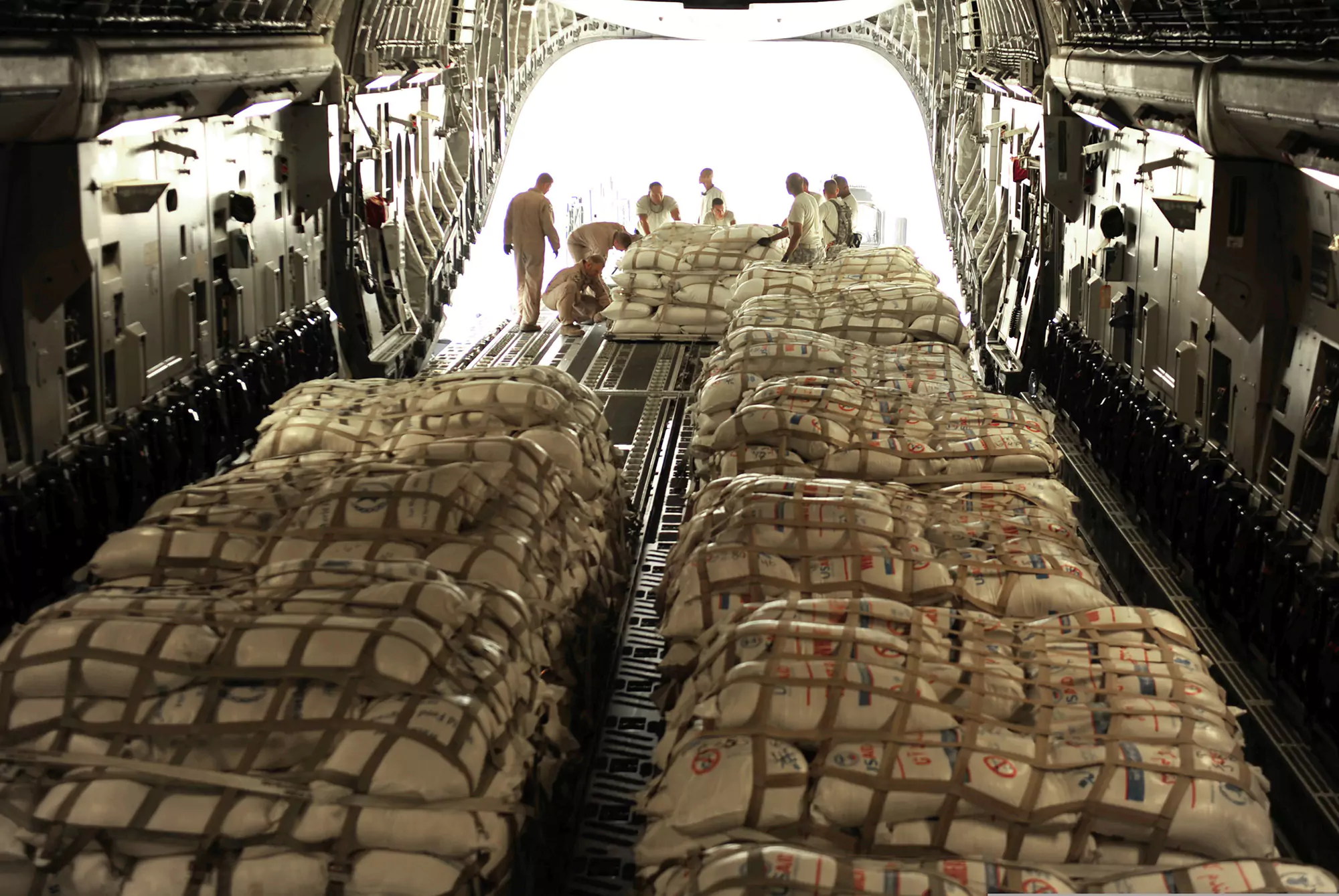 Loading up 463L Pallets on Military Cargo Plane - GSA Contractor